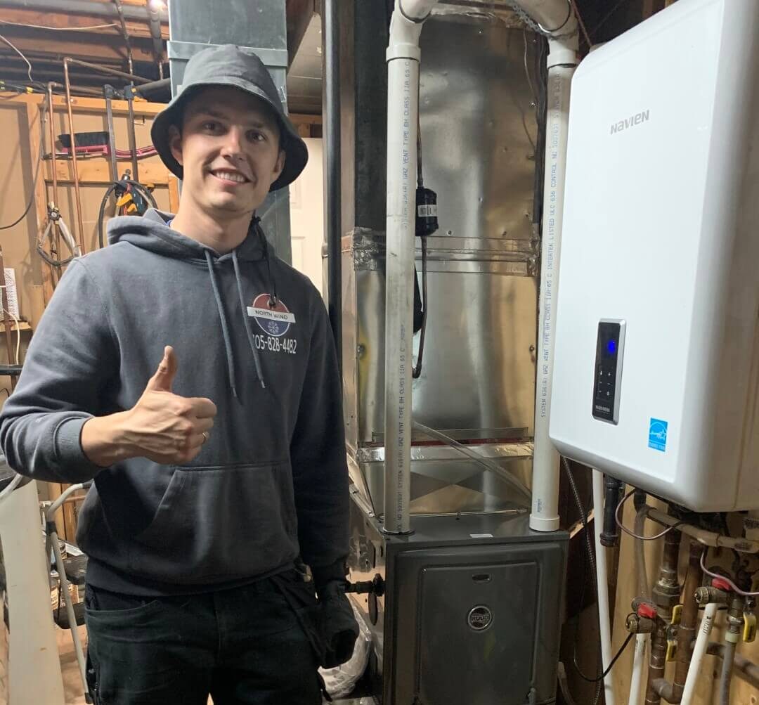 north wind technician repairing furnace